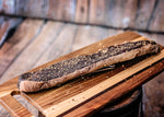 a close up of a wooden bench on a wooden surface 